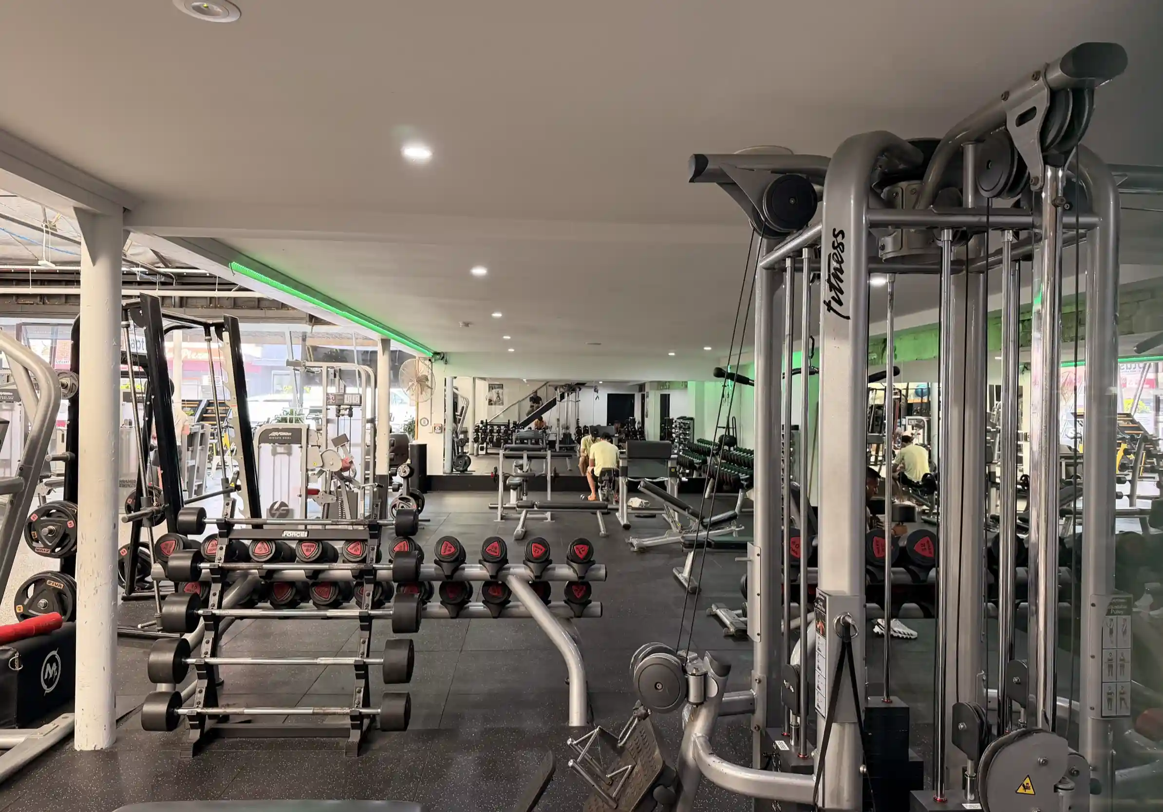 Dedicated free weights area at Aptus Health Club Camberwell featuring Olympic barbells, dumbbells to 50kg, power racks and rubber flooring